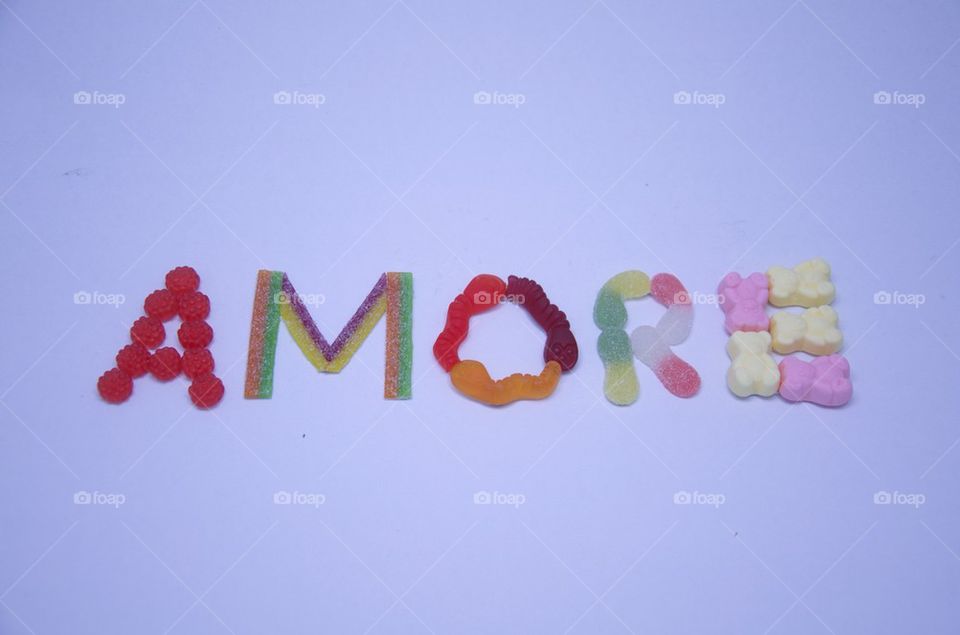 Amore, sweet composition on white background