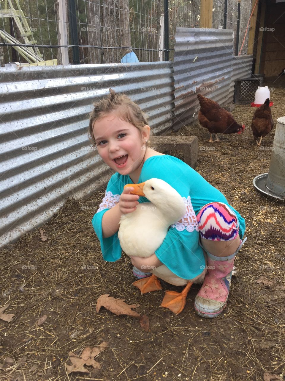 Girl playing with duck