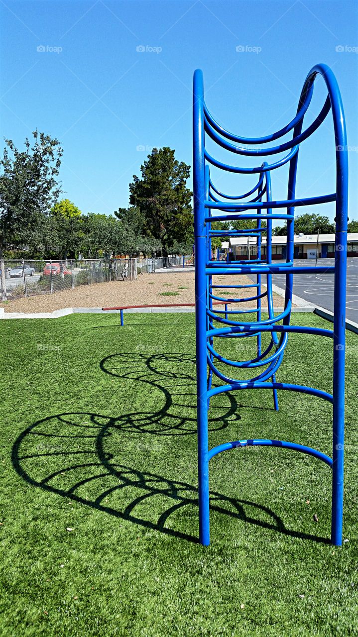 Playground Equipment casting  a serpentine shadow!