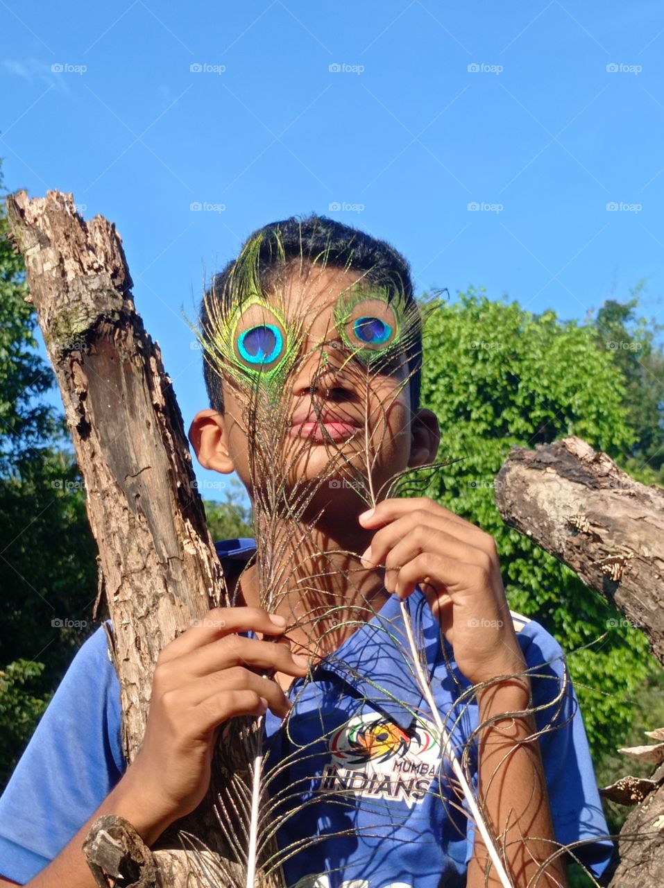enjoying with peacock feather