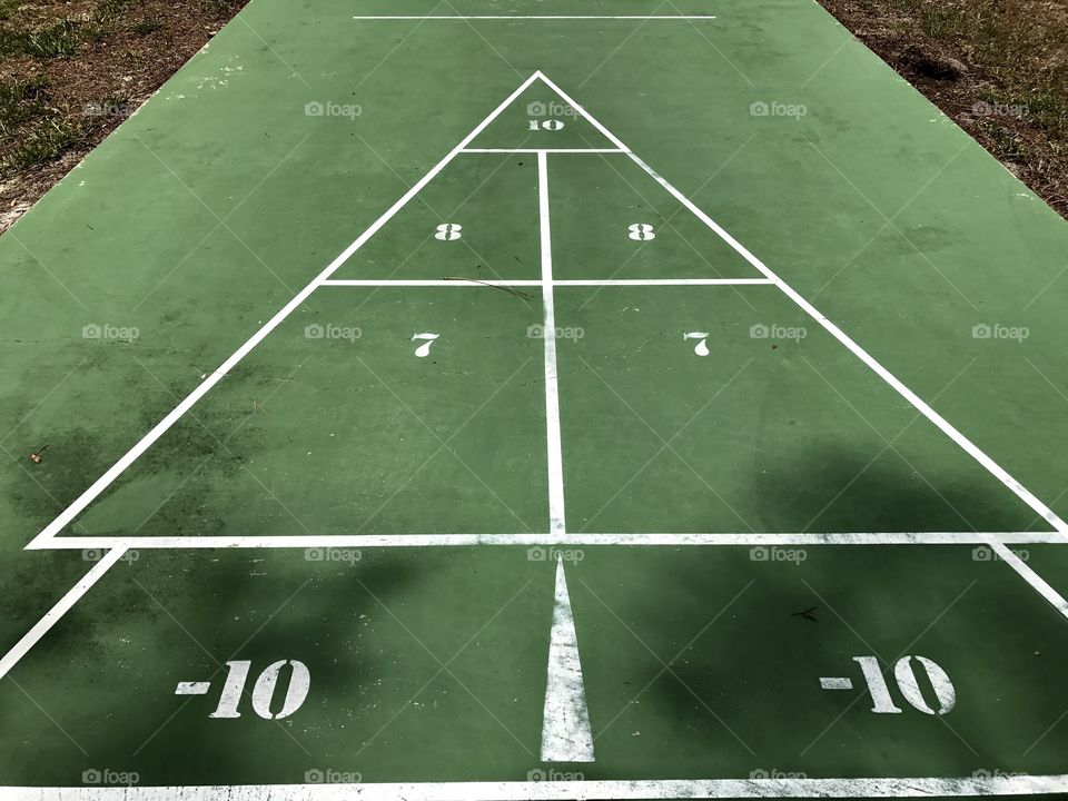 Green shuffleboard surface