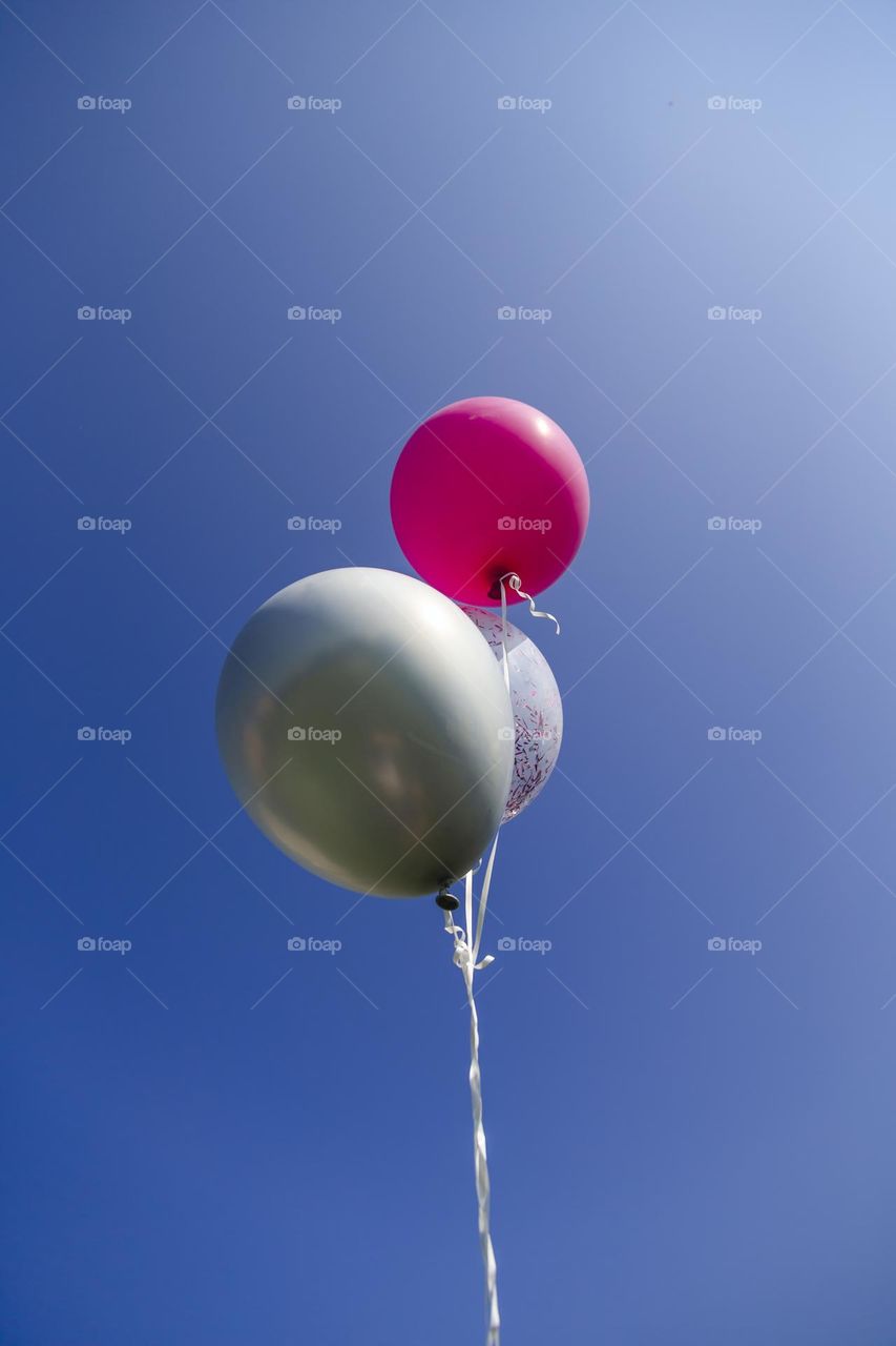 Helium balloons in the sky