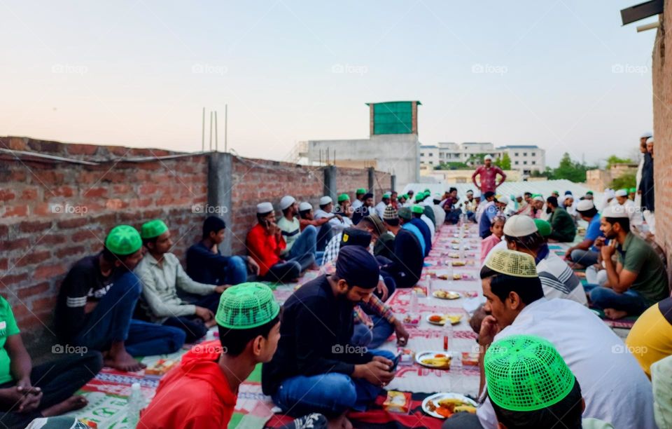 People sitting together to open their fast