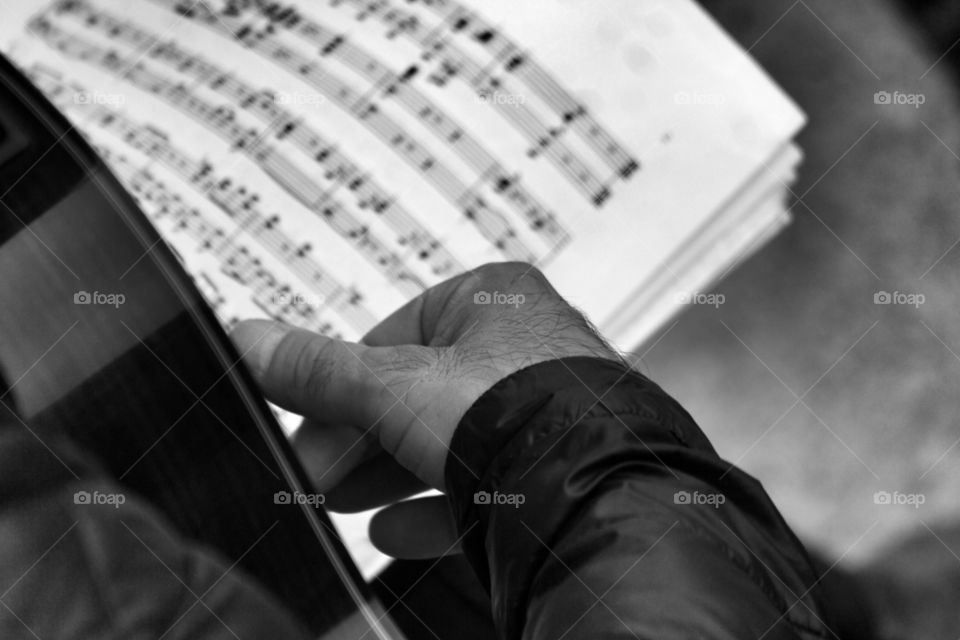 Close-up of a man playing guitar