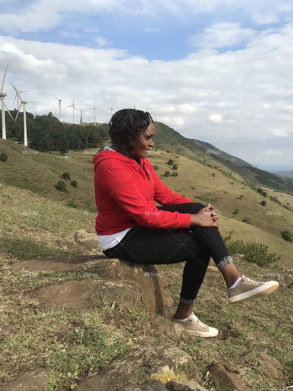 Cloud one person sky wind environment Nature full length Adult Windmill landscape mountain leisure activity day Land Sitting adventure Wind power beauty in Nature outdoors Wind Turbine in Ngong, Kenya