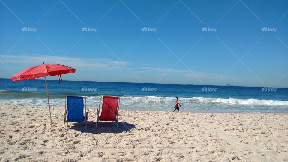 Copacabana Beach with red and blue chairs