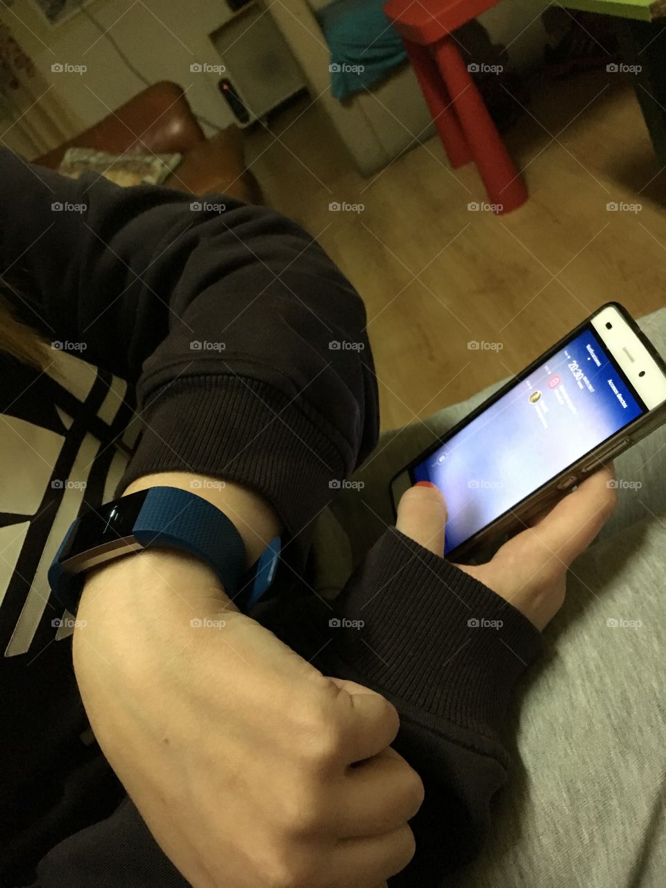 Smart band and mobile phone with girl using it