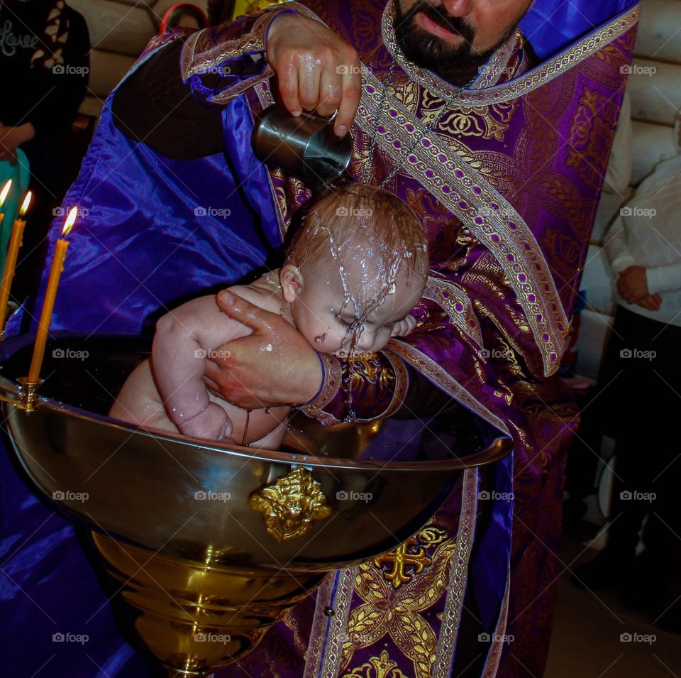 The baptism of the baby in the church