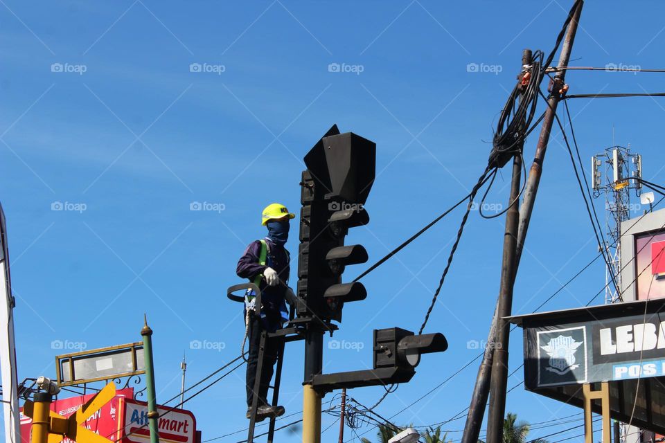 although not too high but quite risky because a technician is repairing an automatic train door that is damaged, if not alert this technician will be electrocuted