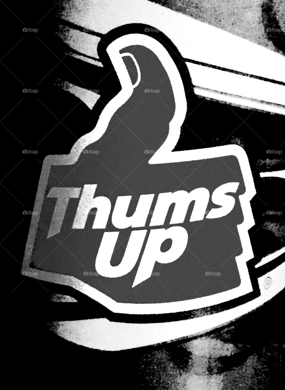 A sign for a drink called thumbs up in India.