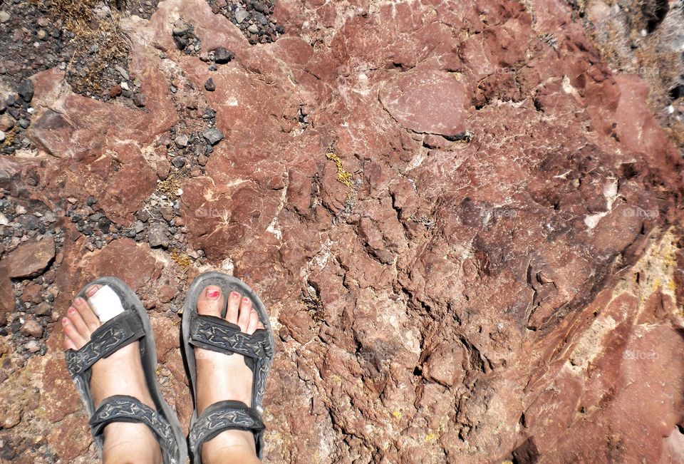 Low section on woman standing on rock