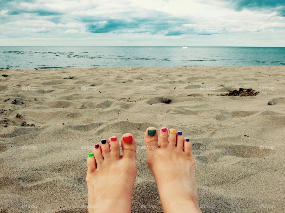 Feet by the Ocean