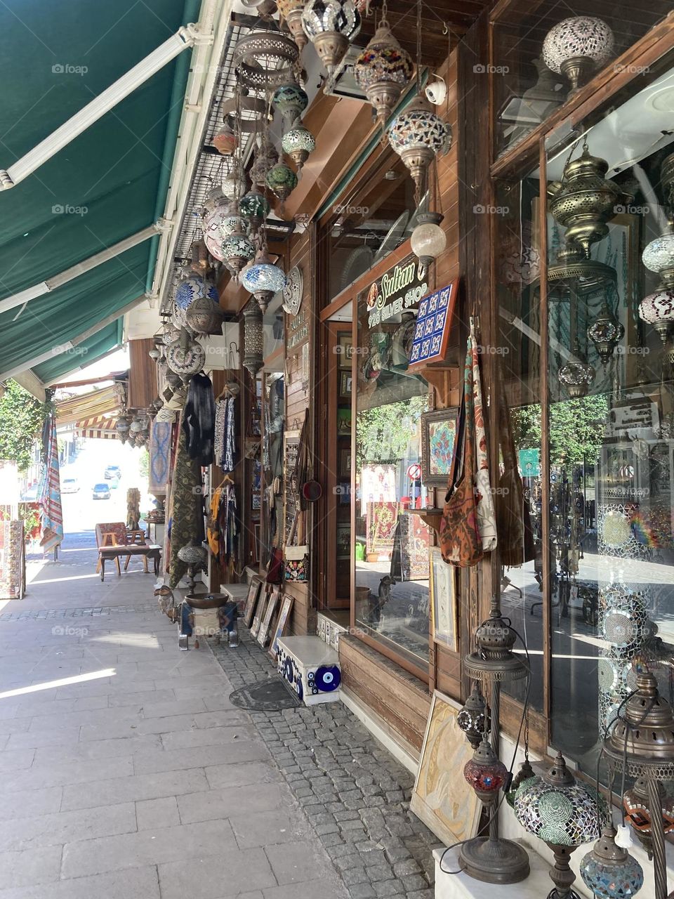 Sunny holidays I’m Turkey. Walk in the cute city and charming streets by the beach in Kusadasi. perfect blue sky and ocean view. Beach and the shore. To travel is to live. Gorgeous tall palm trees.