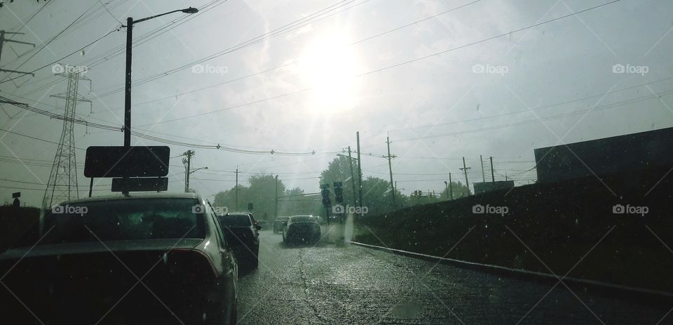 A commute through traffic as the rains pour down.