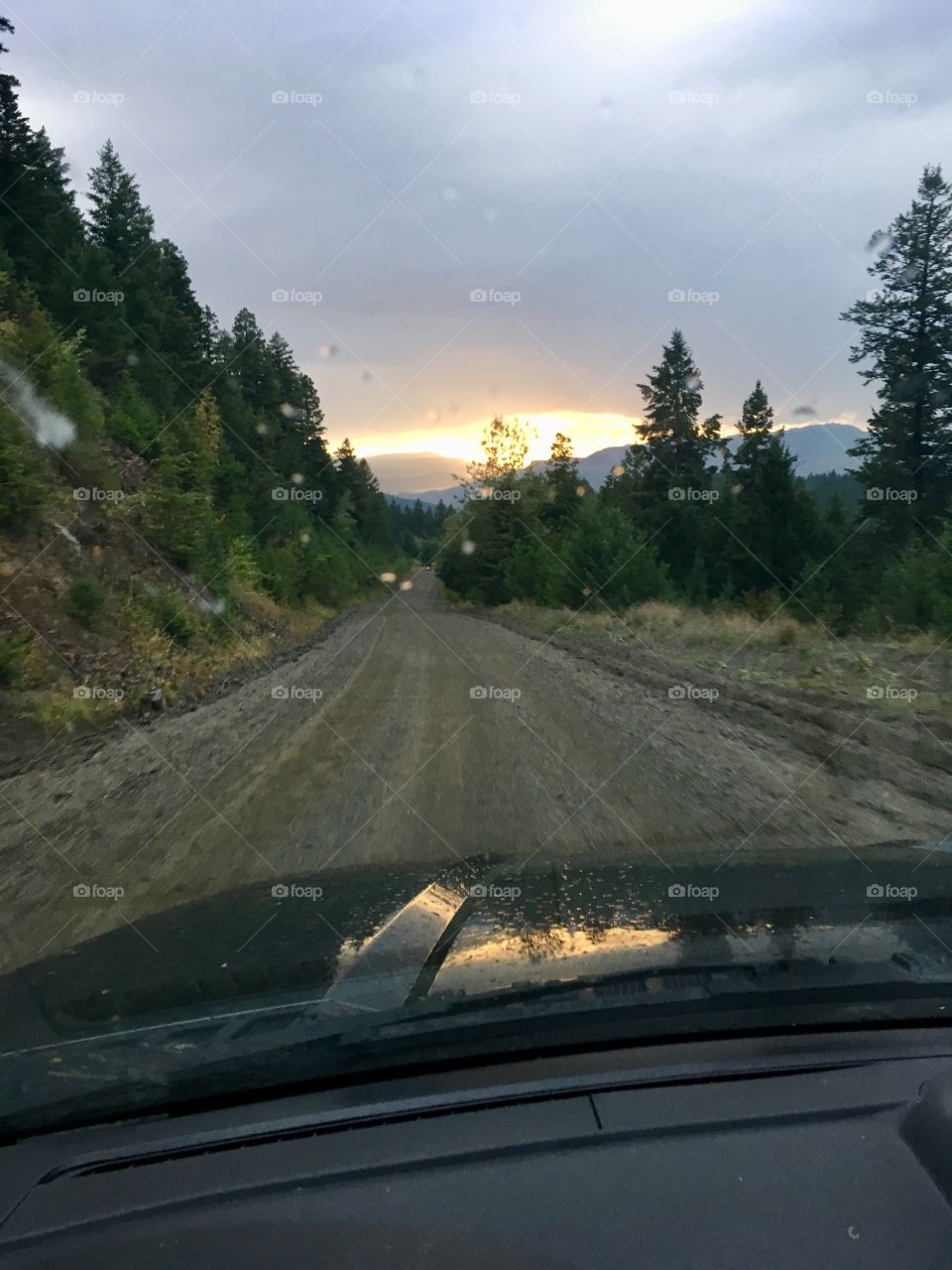 Sunset view through drivers windshield 