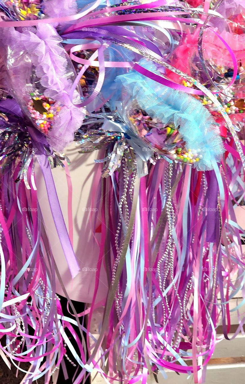 sparkly pink, purple, silver and blue fantasy items for children at a county fair in Oregon