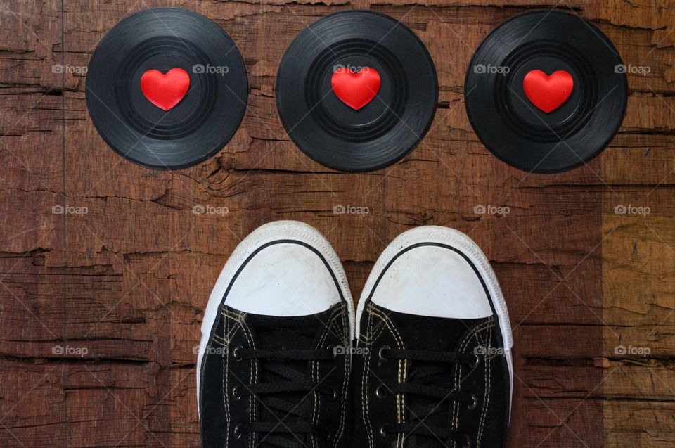 Chucks next to records and hearts