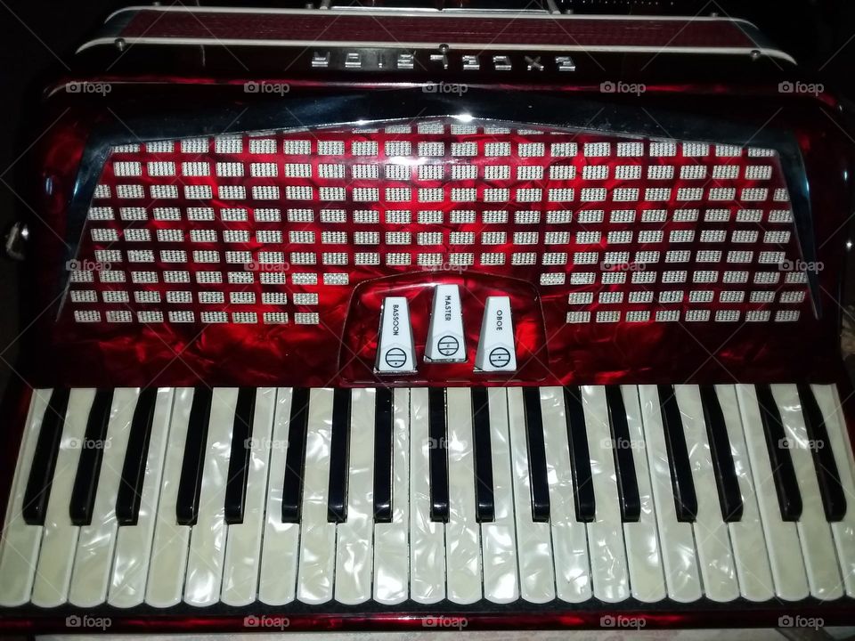 a beautiful red and white Excelsior piano accordion