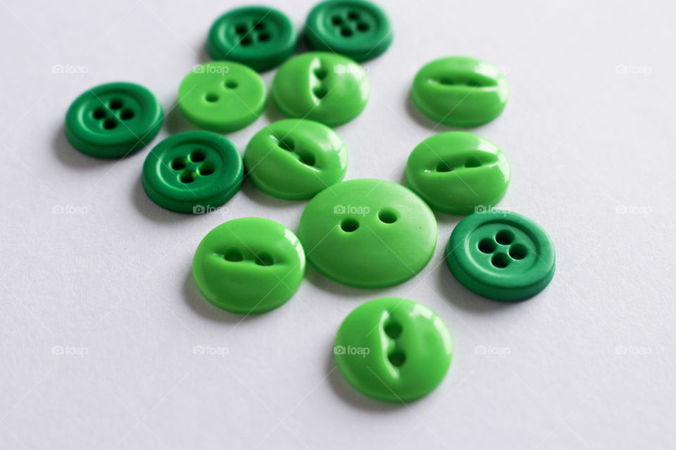 Close-up of green buttons