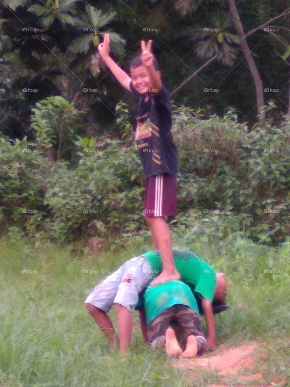 The village boy is happy to play happily