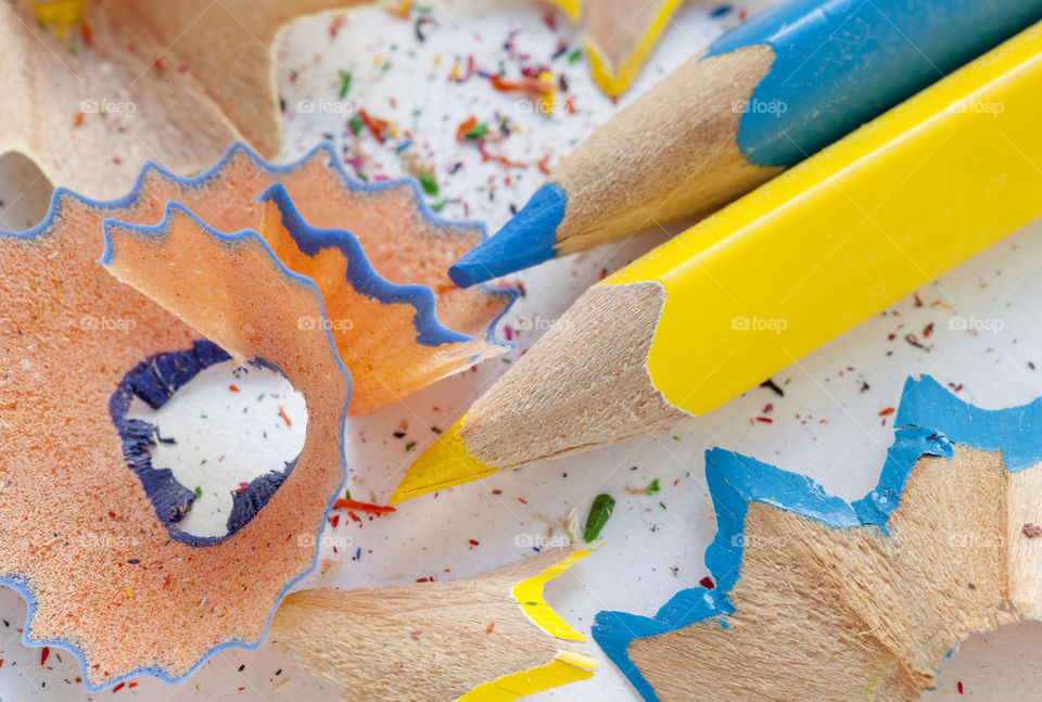 Close-up of blue and yellow pencil