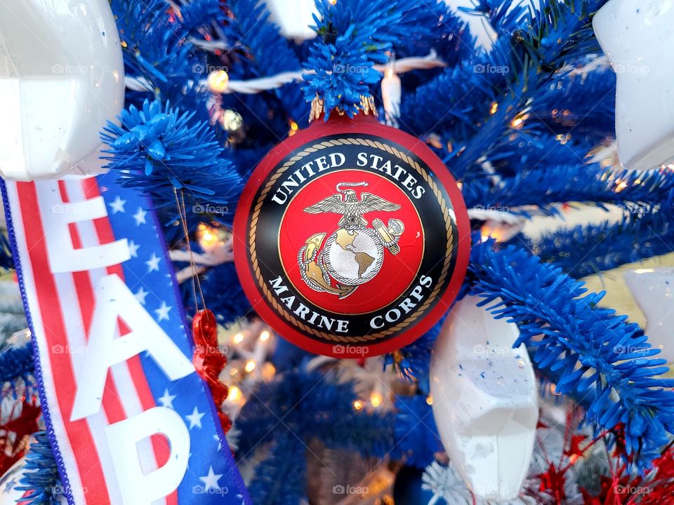 USMC Christmas ornament hanging on a red white and blue Christmas tree