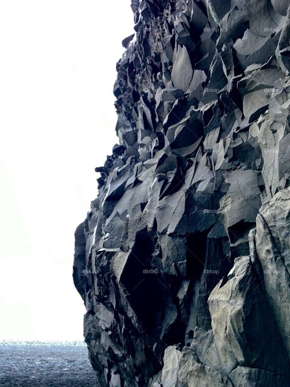 Rock on black sand beach, Iceland 