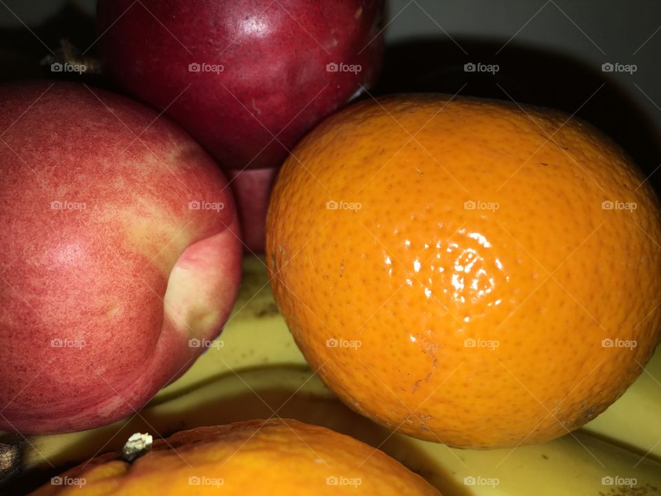 Apples and oranges closeup 