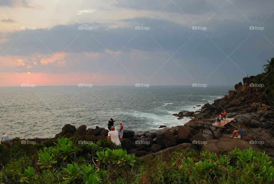 People watching sunset on Indian Ocean 