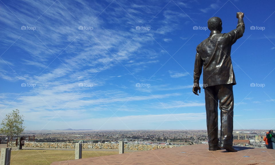high clouds over the giant statue of Nelson Mandela in Bloemfontein, South Africa