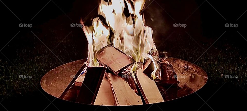 The firewood is stacked extra high to provide fuel for many more hours of bonfire enjoyment especially on a warm balmy evening like it is today in early summer off 2023. Hypnotic Productions