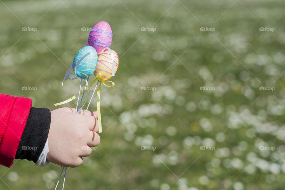 easter eggs decor in little girls hand