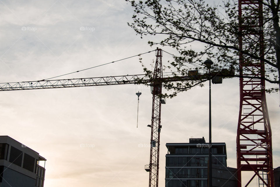 Construction crane at sunset