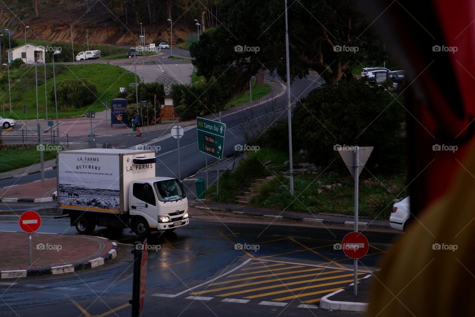 truck moving slowly in wrt rainy day with slippery roads