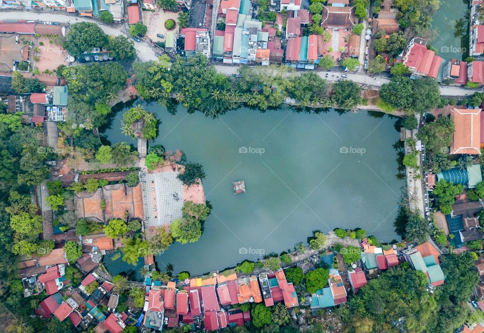 Thay Pagoda from aerial view with heart lake and blue water. 
Thay Pagoda is one of the famous Pagoda in Quoc Oai, Ha Noi,  Vietnam