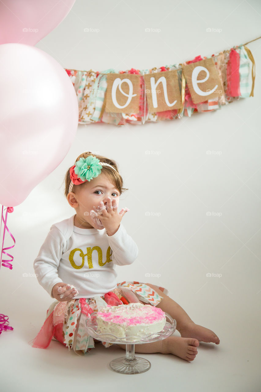 Cute girl eating cake