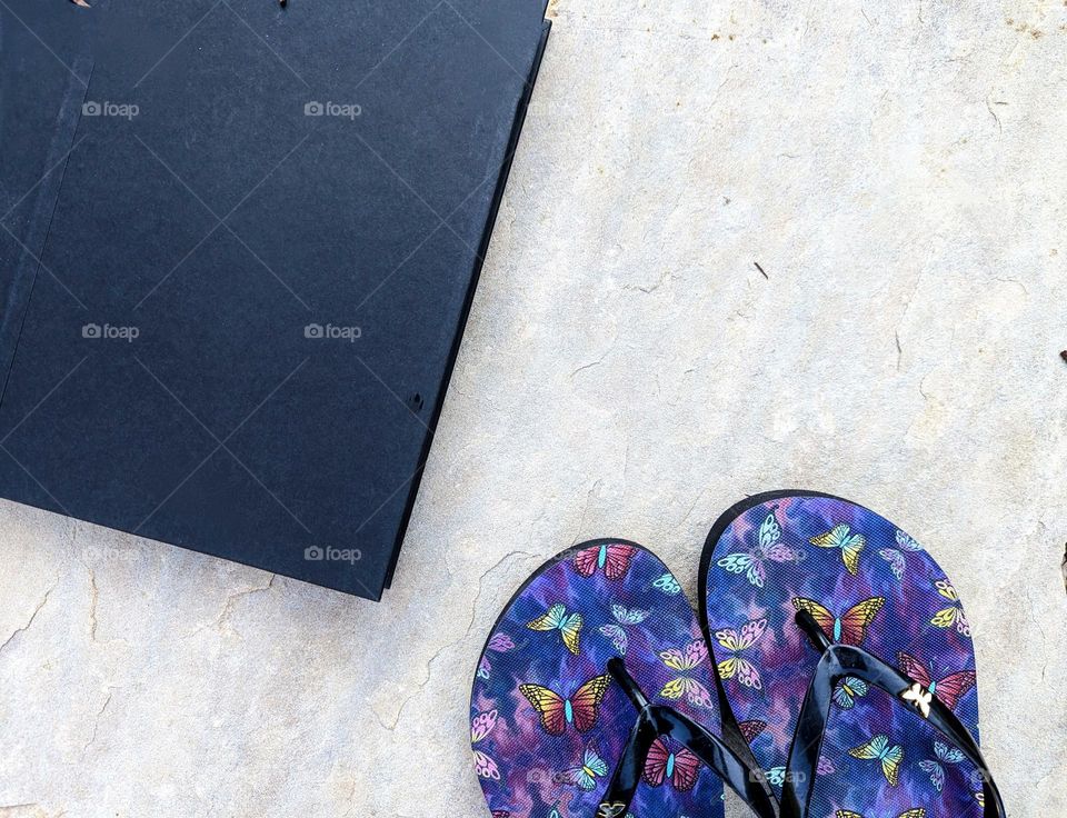 Vacation products book and flip flops