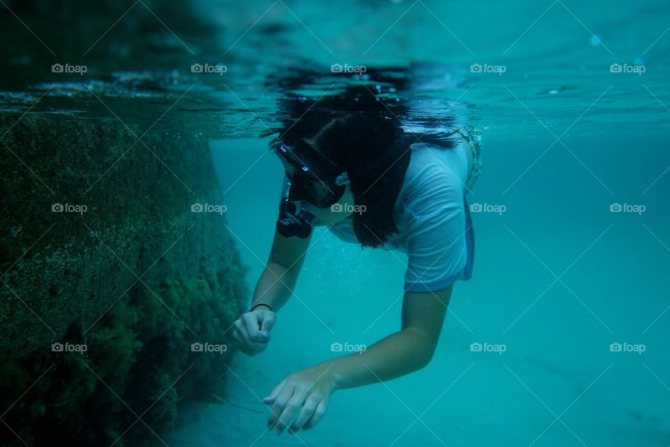 Girl exploring and skin diving