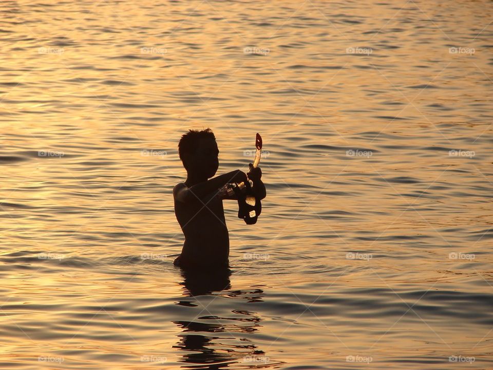 Kid snorkeling in the sea