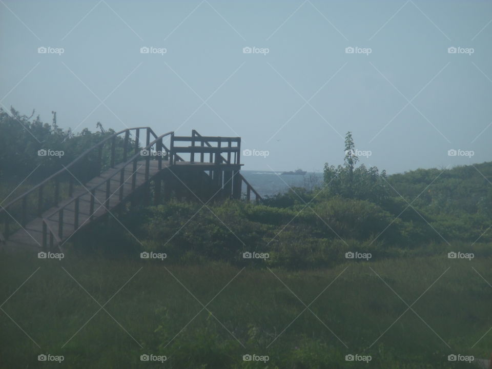 beach boardwalk. This is a boardwalk that leads to the beach near the Gulf of Mexico shoreline