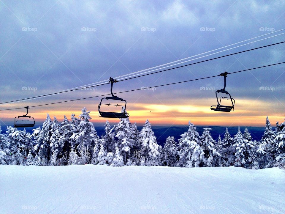 Snowy landscape over the empty ski lift