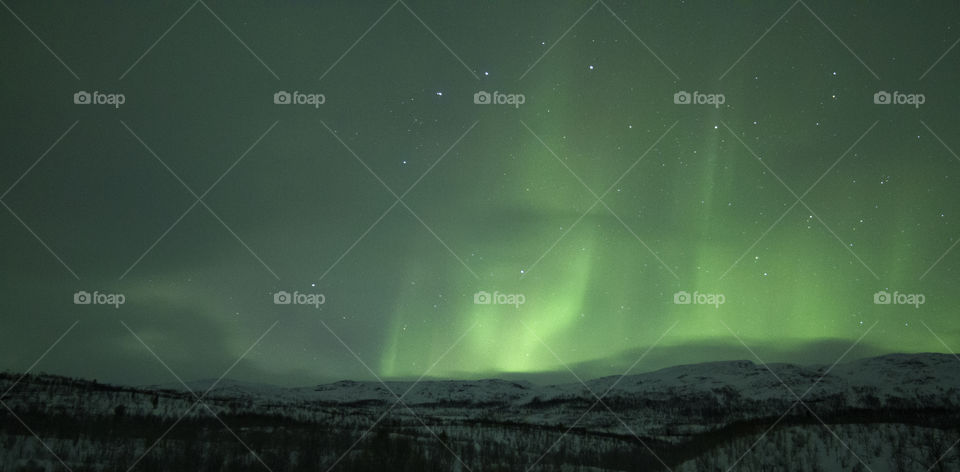 Northern lights in the mountains close to tromso, norway