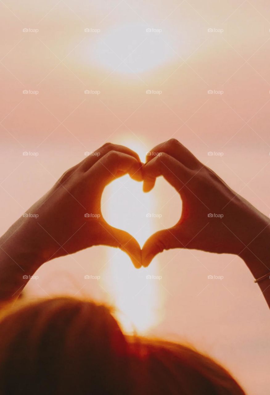 love image create with hand looks so nice morning sun shadow adjust in love symbol