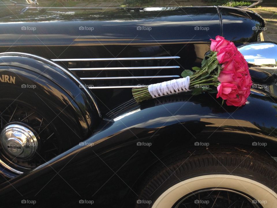 Fancy antique Auburn limo and bouquet