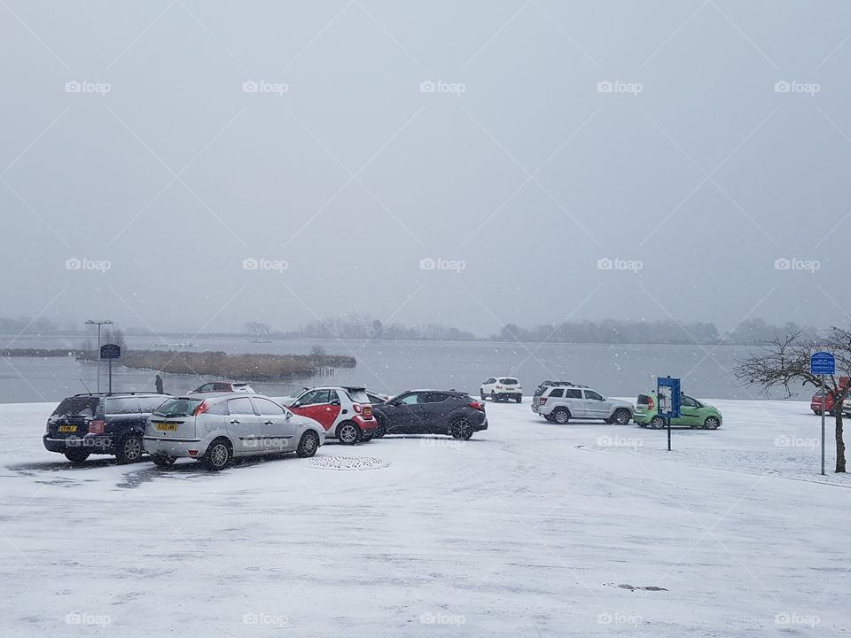 Snowy car park by the lake