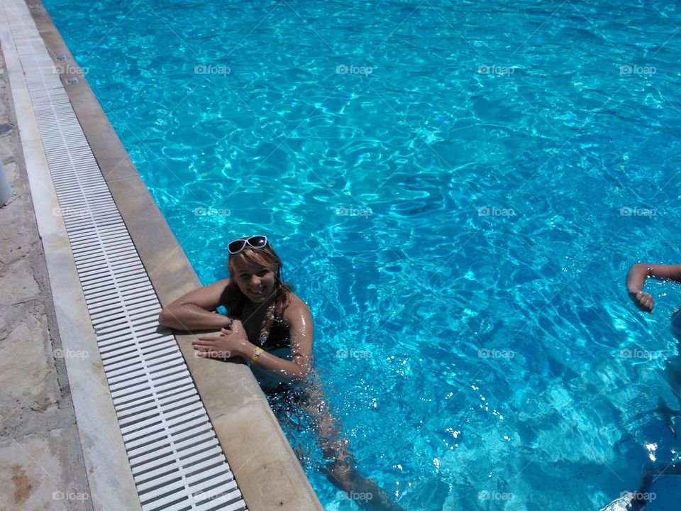 Happy woman in swimming pool