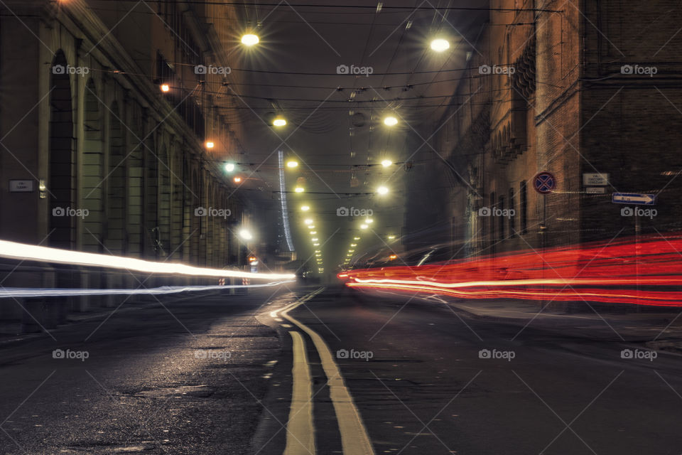 Empty road against building