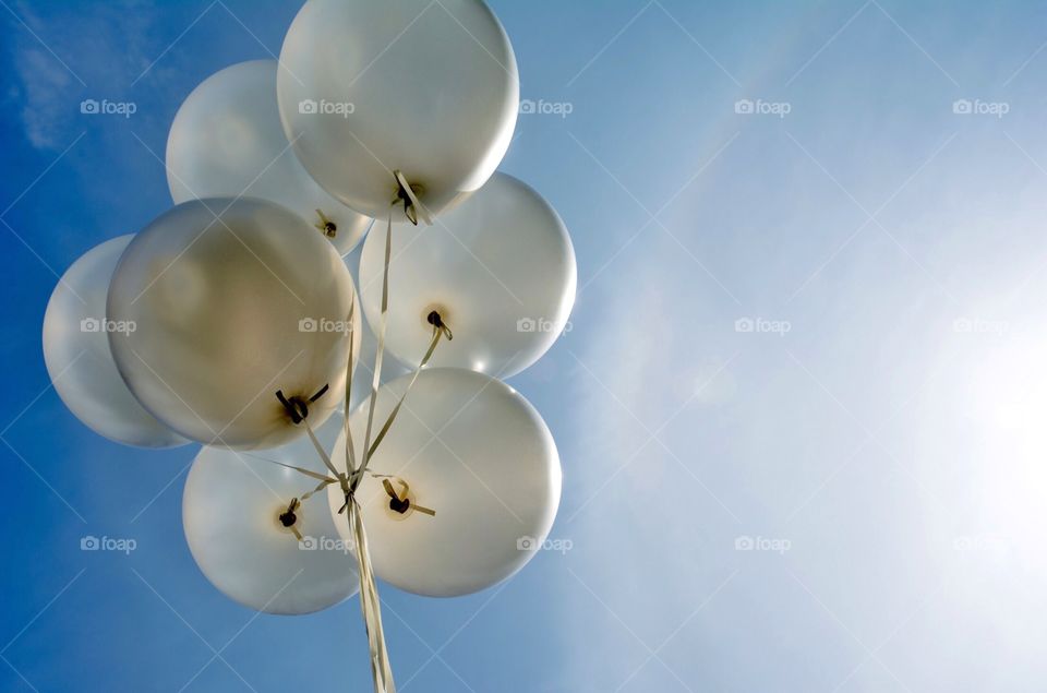 White Balloons against the Sky