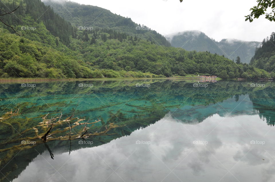 Reflection of mountains in a turquoise lake