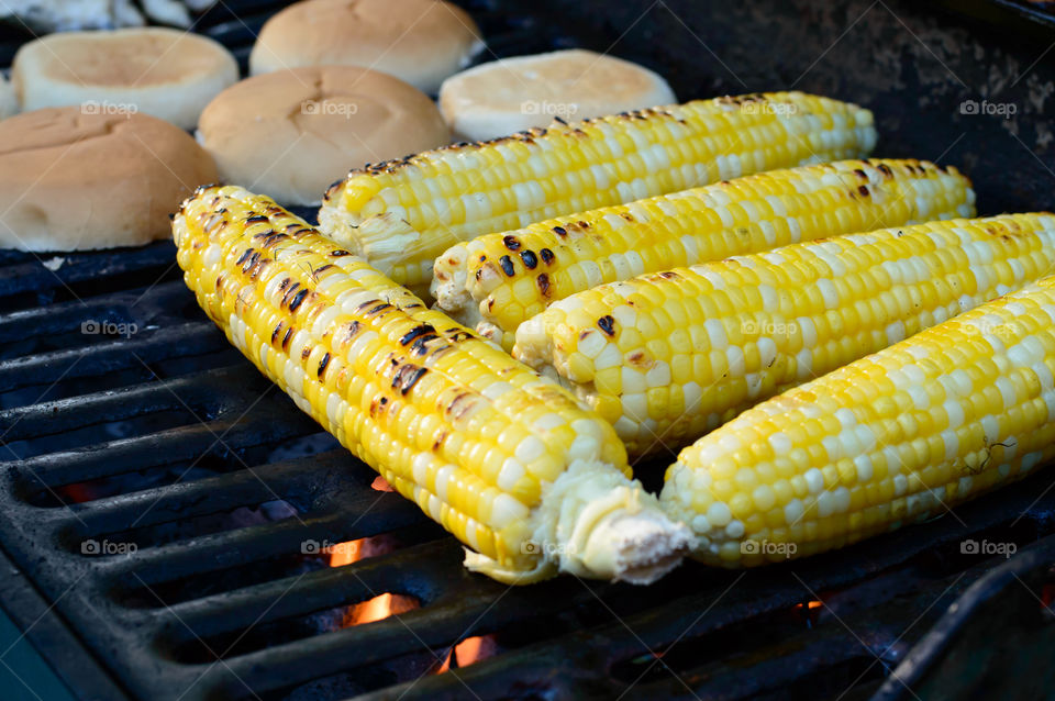 Closeup of autumn corn roast on bbq 